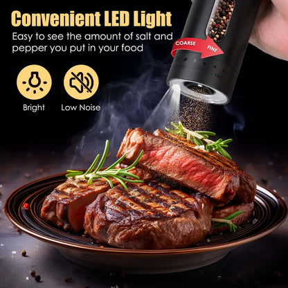 Black rechargeable electric pepper grinder with spout releasing pepper, LED light at top