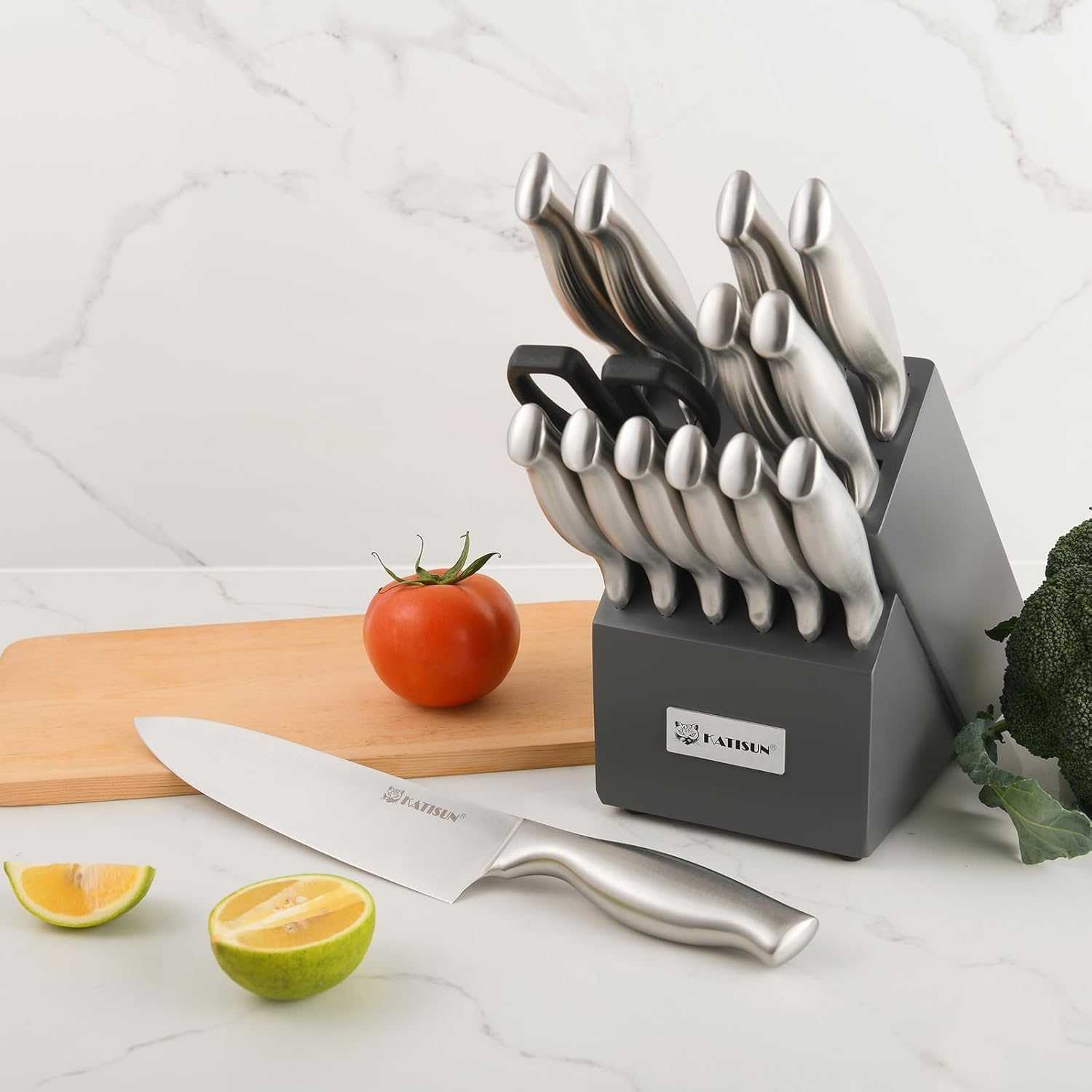 15-piece knife set with stainless knives in gray block and chef knife on board