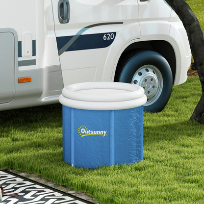 Blue cold plunge tub with white rim and support poles set up on grass