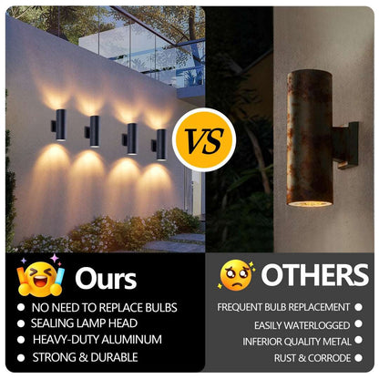 Matte black cylinder outdoor wall light next to a stained cylinder on exterior wall