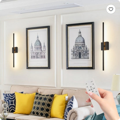 Black LED wall sconce set with slim vertical light bars, glowing warm