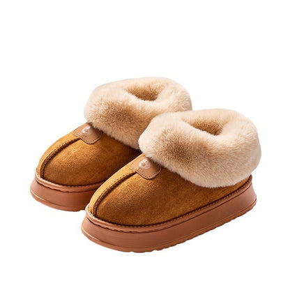 Pair of brown slippers with beige fur trim on a white background