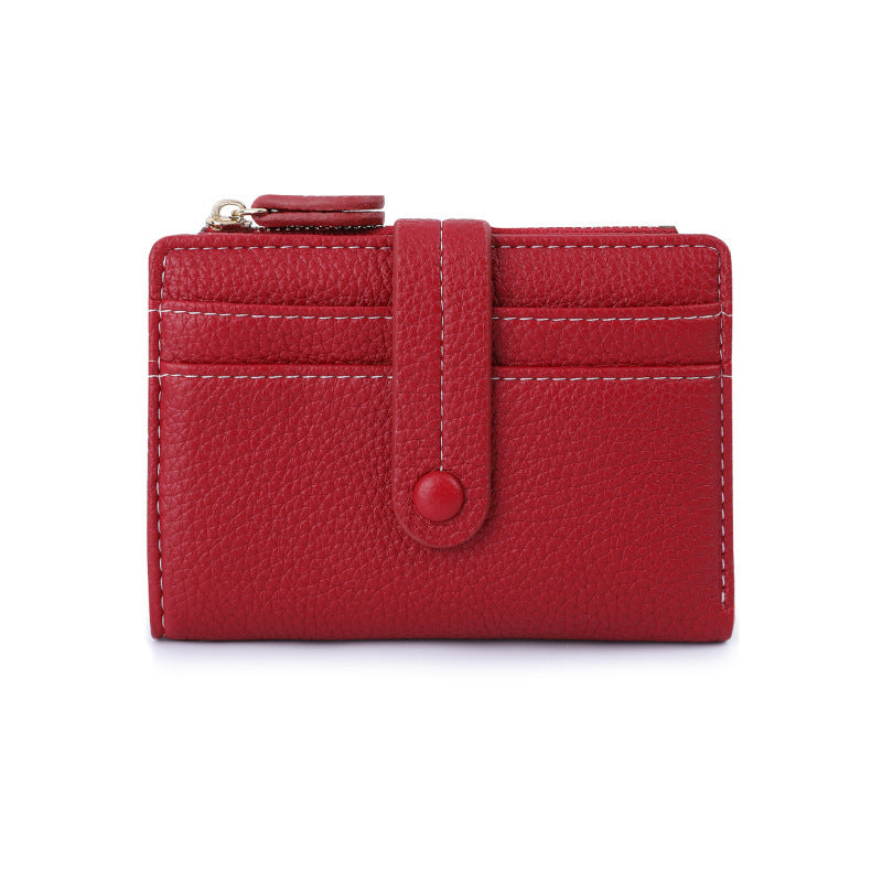 Red short wallet with card slots, snap button tab, and coin zipper pocket