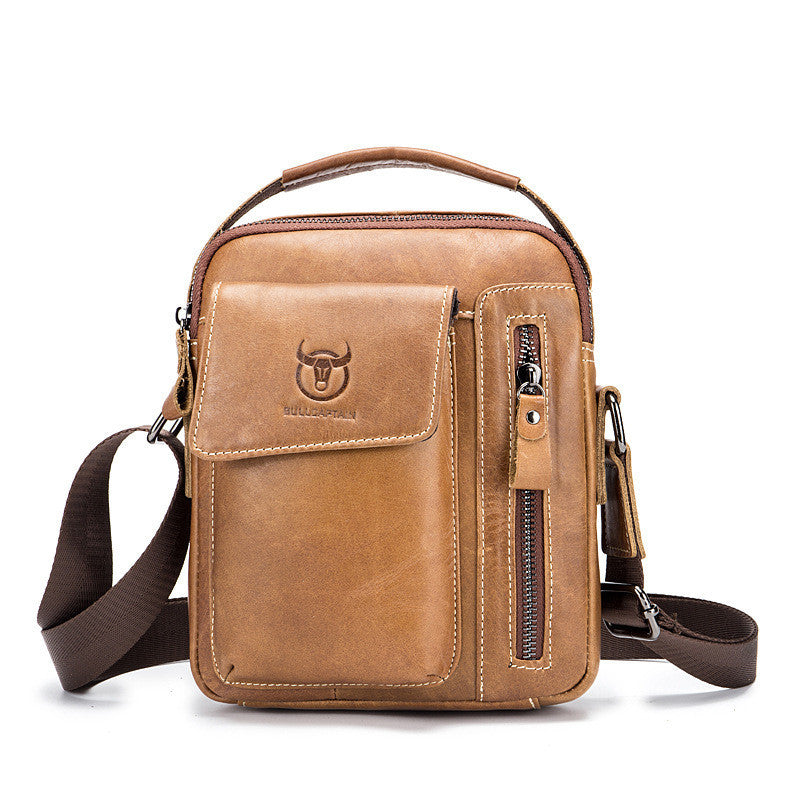 Tan leather messenger bag with front flap, vertical zip pocket, and crossbody strap.