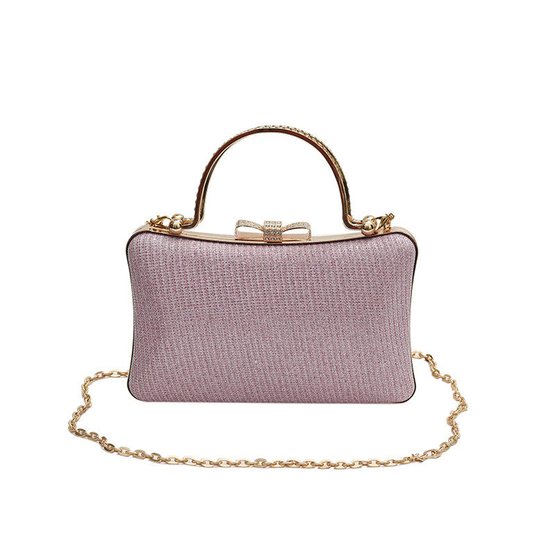 Glitter shoulder messenger bag, pink with gold top handle, clasp, and chain strap