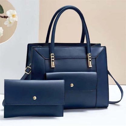 Navy blue tote bag set with top handles and matching mini crossbody bag