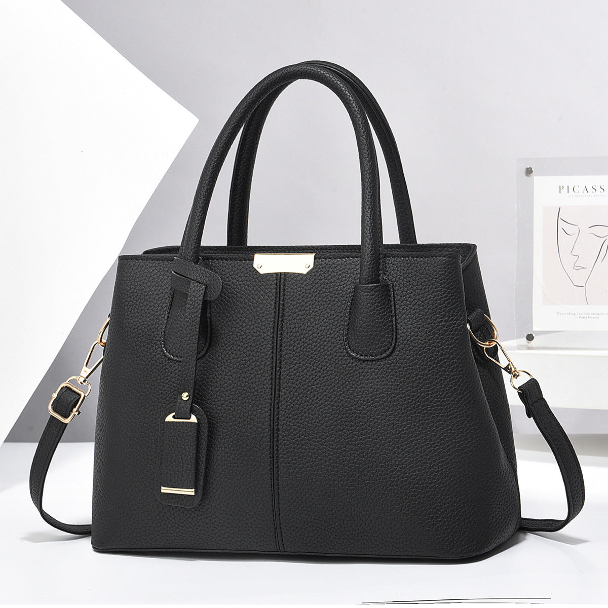 PU leather tote & crossbody bag, black with gold-tone hardware and crossbody strap
