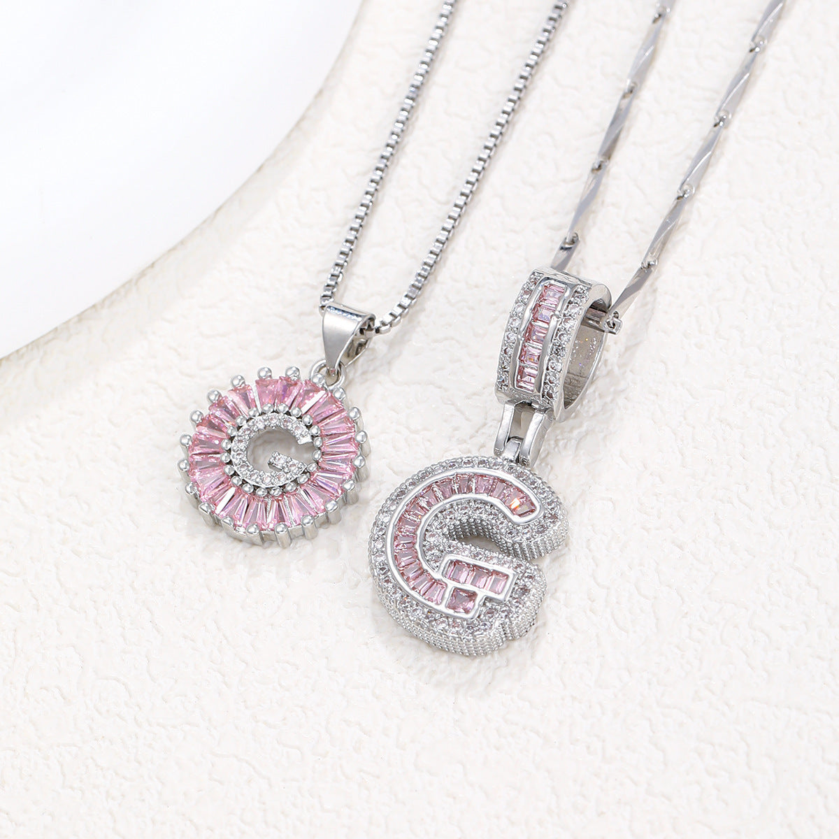 Silver-tone pendant necklace set with pink crystal flower halo pendant and letter pendant charm