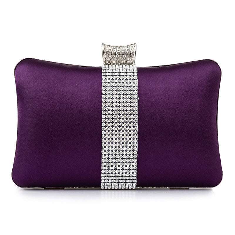 Purple satin banquet clutch with rhinestone buckle strap on the front panel