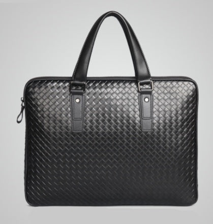 Black woven leather briefcase with two top handles, front straps, and zipper sides