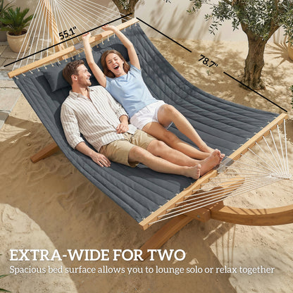 Gray extra-wide hammock for two with pillow, both people reclining on the padded surface