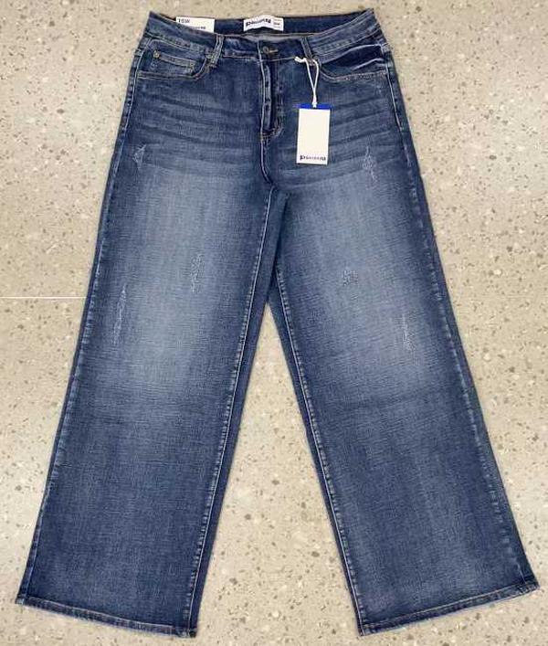 High-waisted flare jeans flat lay in medium blue denim wash, wide leg with stitched hem.