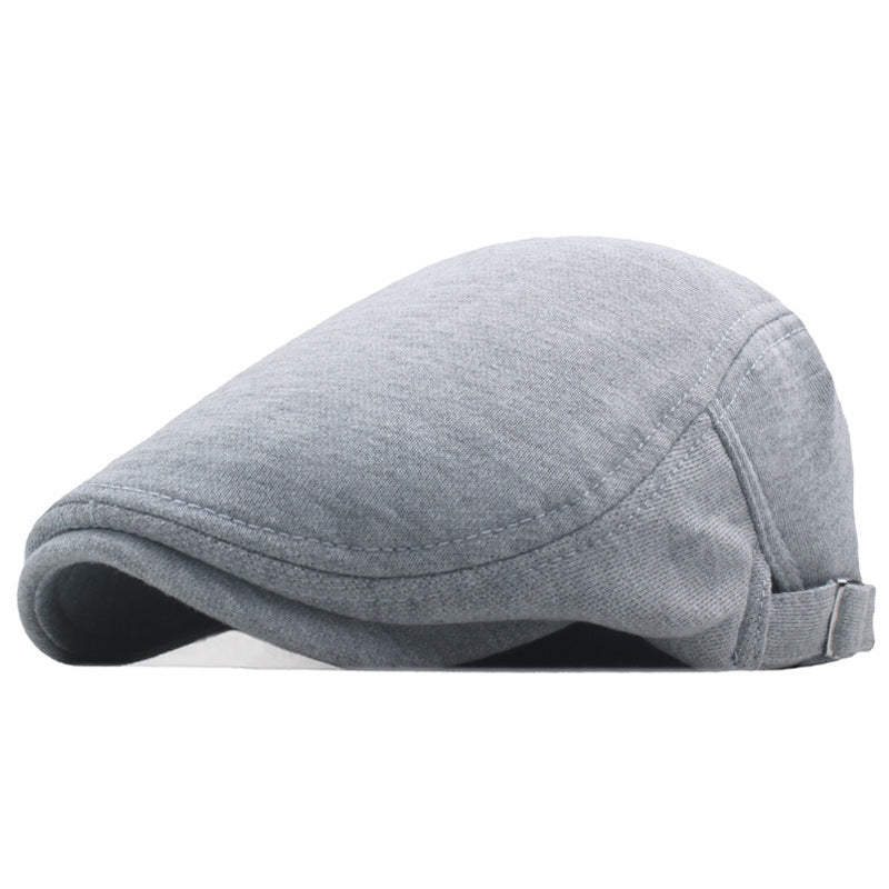 Light gray newsboy cap with curved brim and adjustable strap, side profile