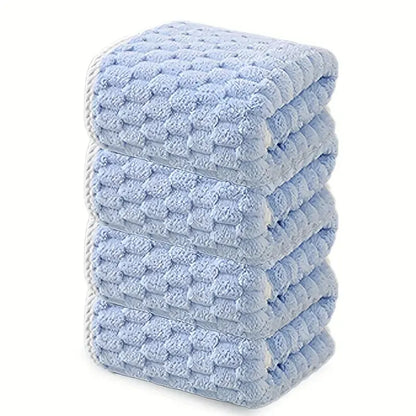 Waffle bath towel set, folded stack of light blue towels with raised waffle texture