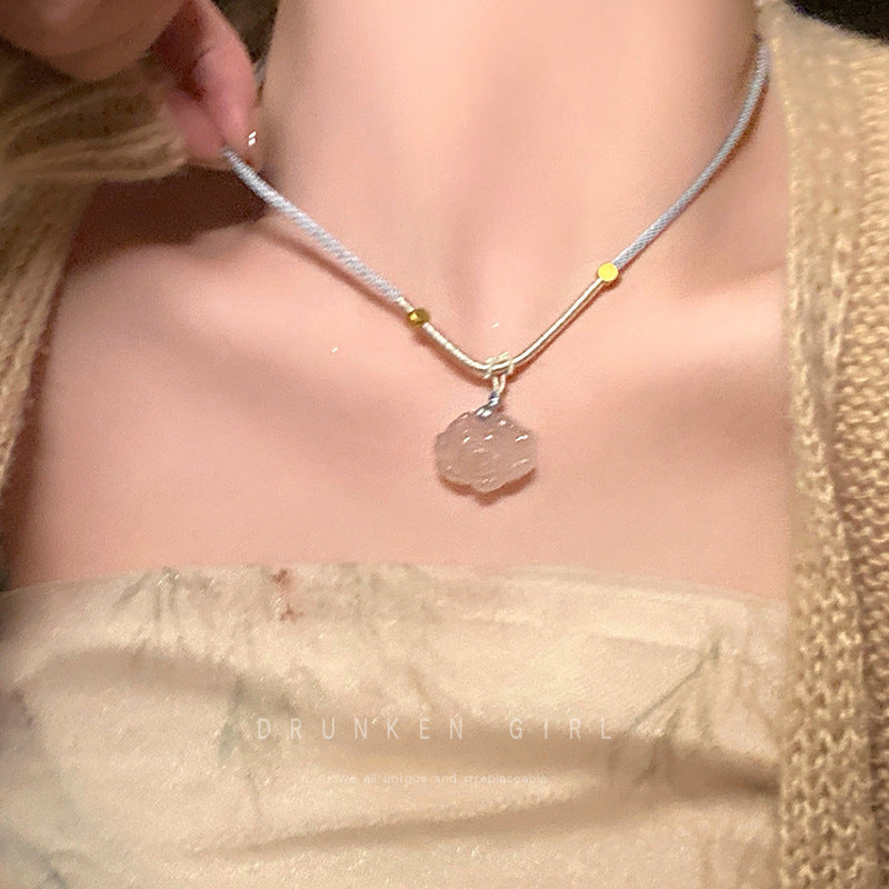 Butterfly pearl necklace with slender chain and round pearl pendant below butterfly charm