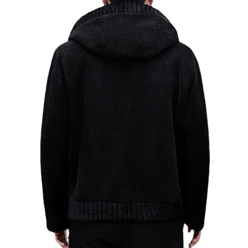 Black hoodie worn by a person on a white background