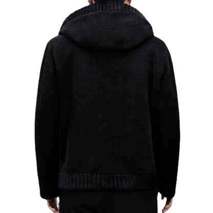Black hoodie worn by a person on a white background