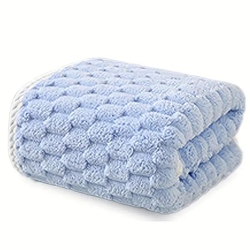 Waffle bath towel set, folded stack of light blue towels with waffle texture
