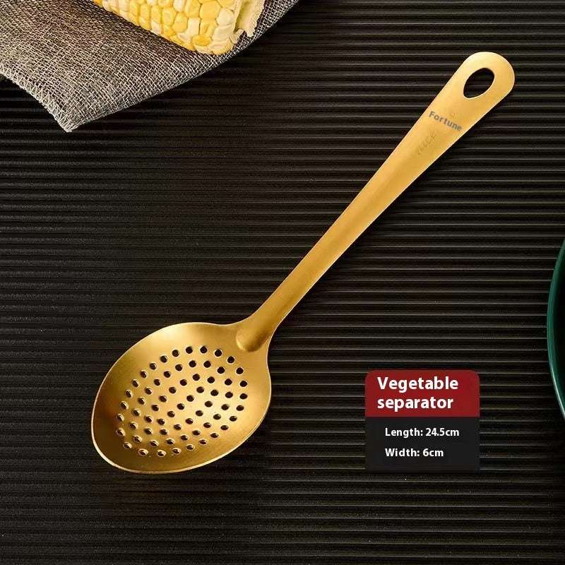 Gold vegetable separator on a dark surface with text indicating dimensions.