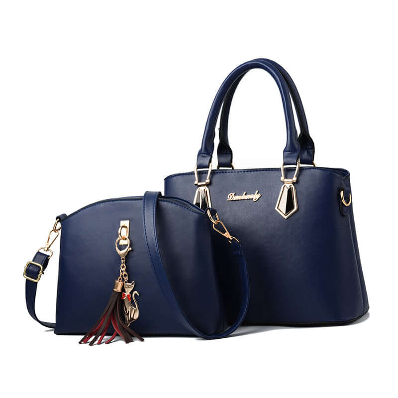 Blue faux-leather crossbody handbag with tassel charm, gold hardware, and front oval pocket