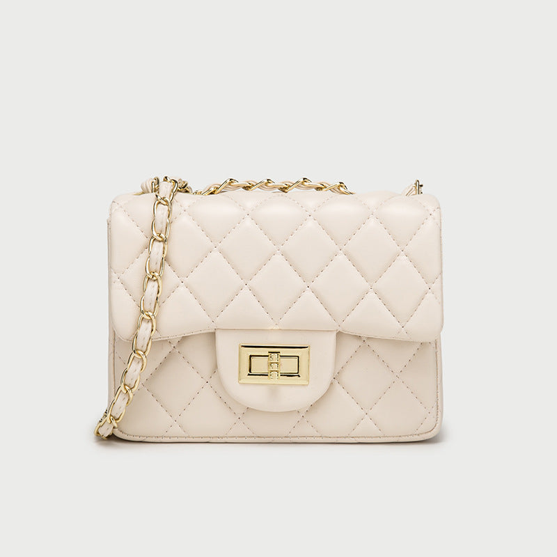 White quilted mini messenger bag with gold chain strap and front flap square clasp