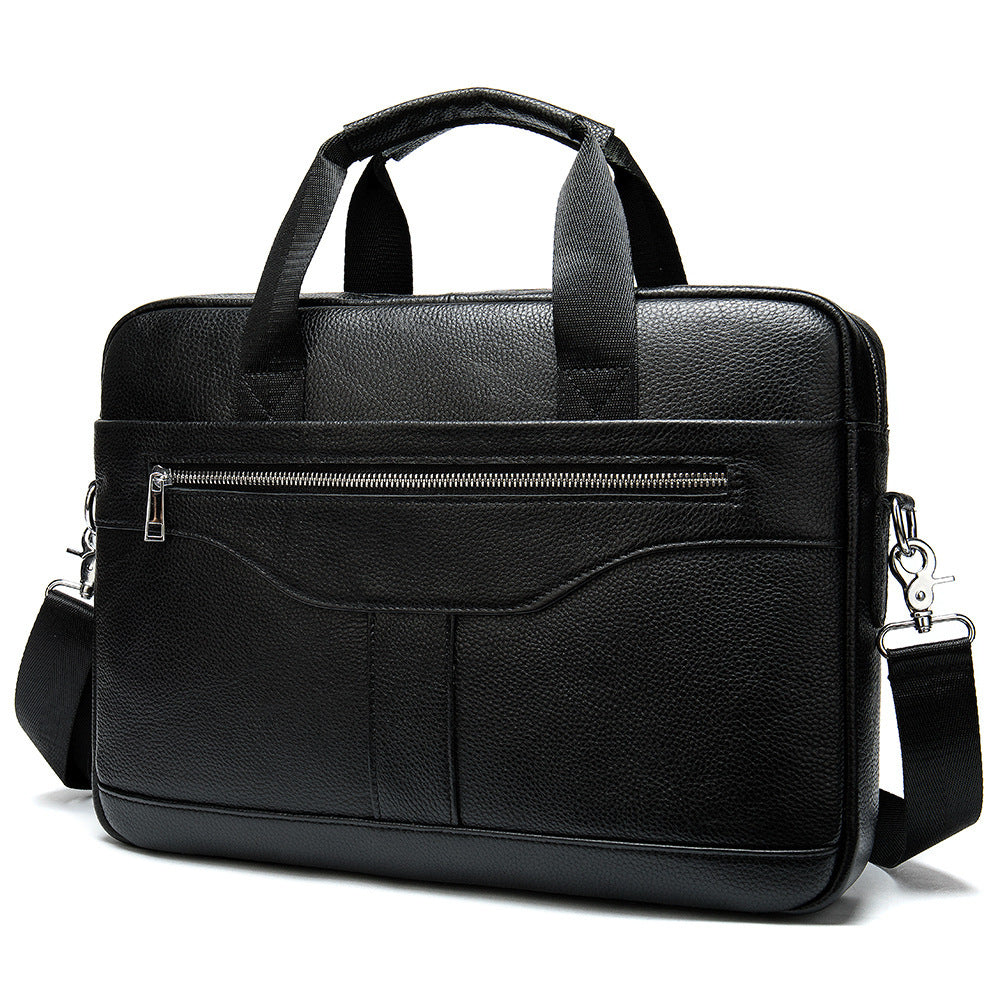 Black leather briefcase with front zipper pocket, curved flap detail, and shoulder strap