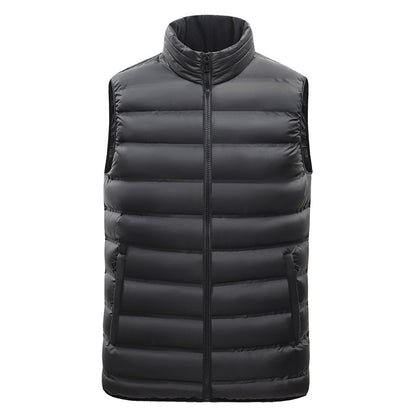 Black puffer vest on a white background