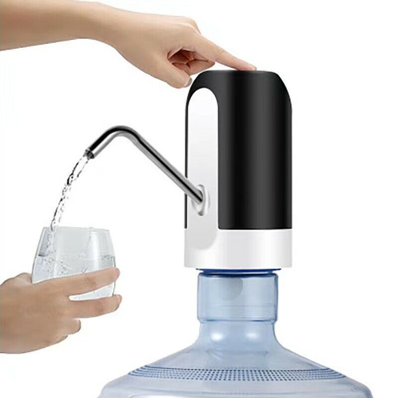 Electric water bottle dispenser in use, dispensing water into a glass