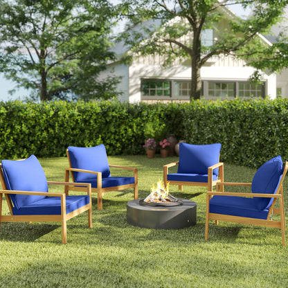 Navy blue patio chair cushions on wooden-framed chairs in a backyard yard setting