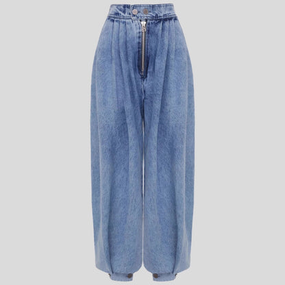 Blue high-waist harem jeans front view, zip closure and pleated waistband