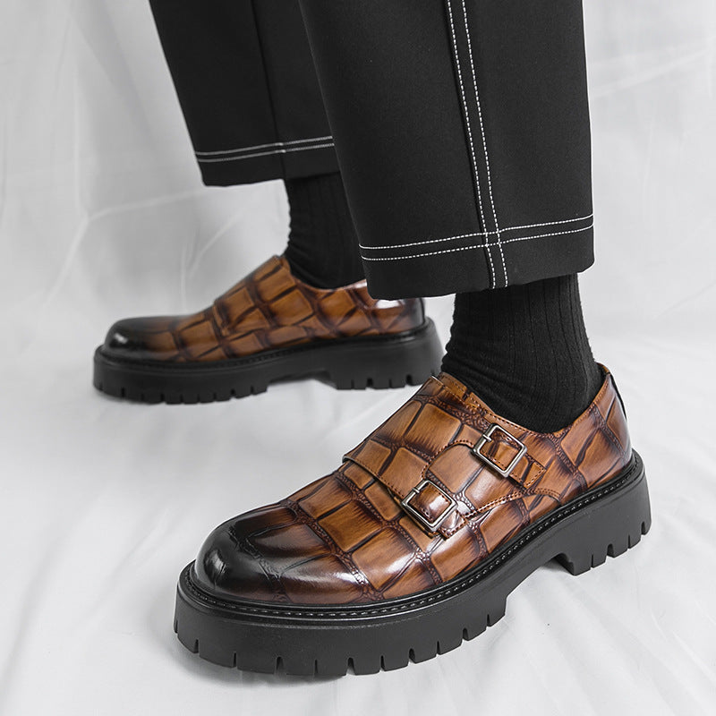 Brown leather slip-on loafers with horsebit buckle and rugged tread sole