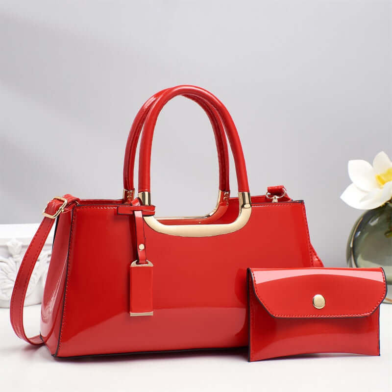 Red hobo shoulder bag with gold-tone handle and matching flap wallet pouch
