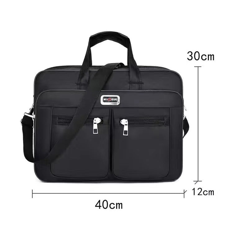 Black laptop bag with front dual zip pockets, top handle, and adjustable shoulder strap