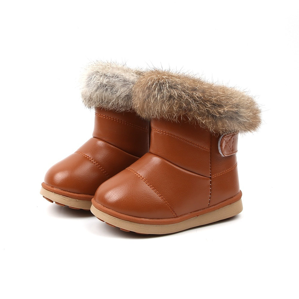 Baby girl snow boots with rabbit fur trim, brown leather-style upper and tan fur cuffs.