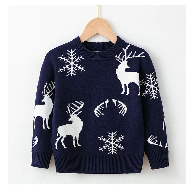 Kids navy Christmas sweater with white reindeer, snowflakes, and candy-cane motifs