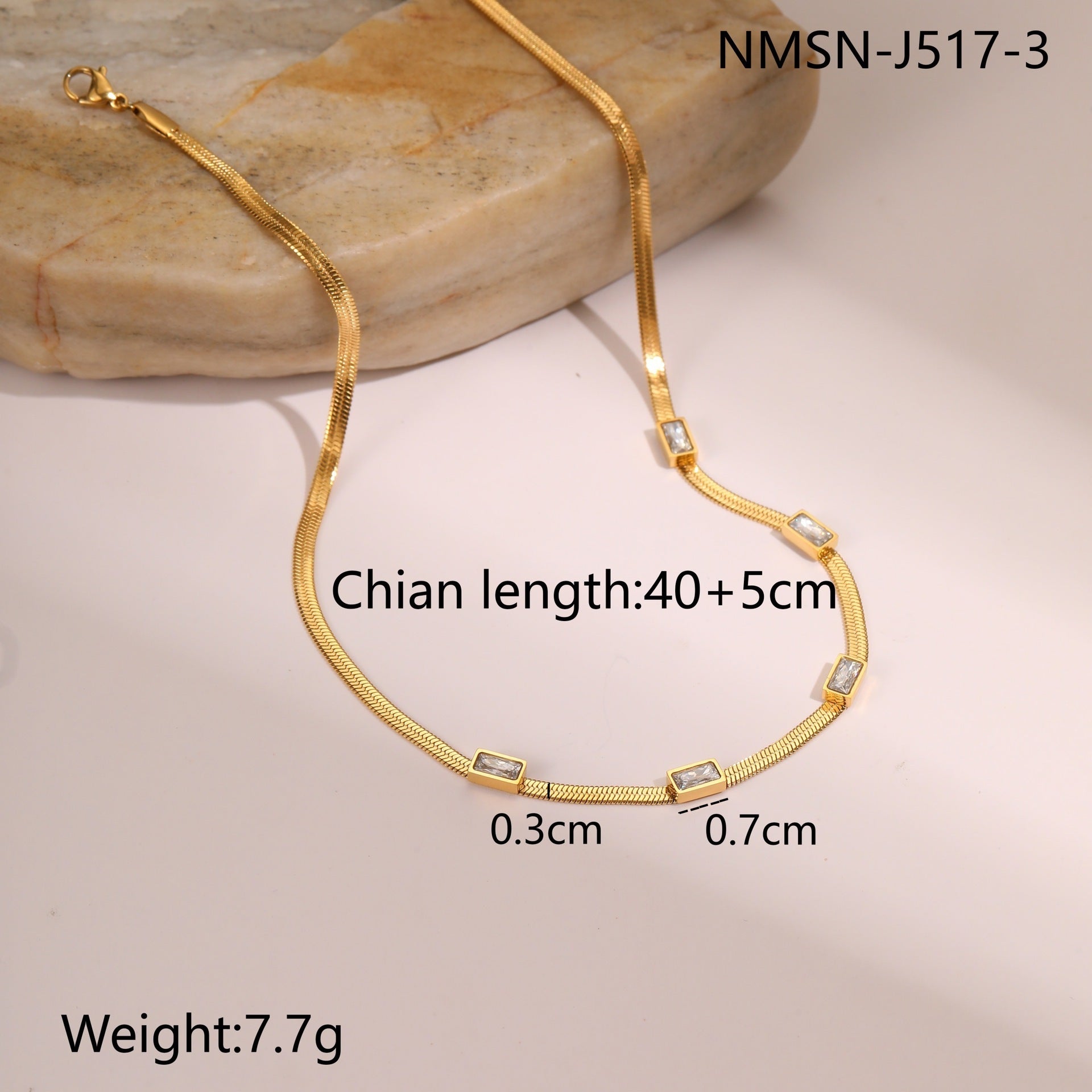 Gold snake chain necklace with square zircon links and black accents