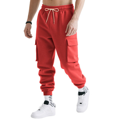 Men's loose cargo jogger pants with drawstring waist, side cargo pockets, red, ribbed cuffs.