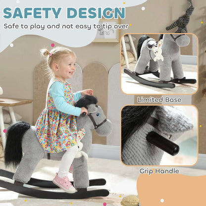 Young child standing with a gray plush rocking horse ride-on, rabbit accessory attached