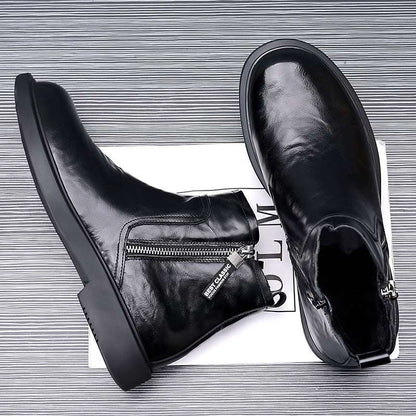 Black leather boots with zippers on a white background