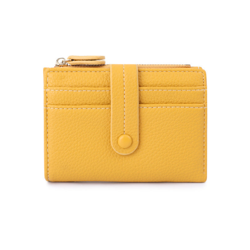 Yellow short wallet with card slots, snap button tab, and coin zipper pocket