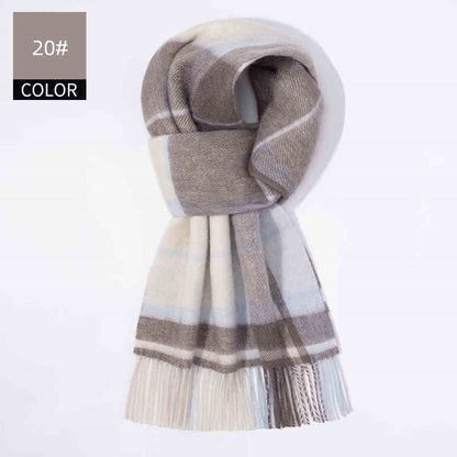 Plaid scarf in brown and beige on a light gray background