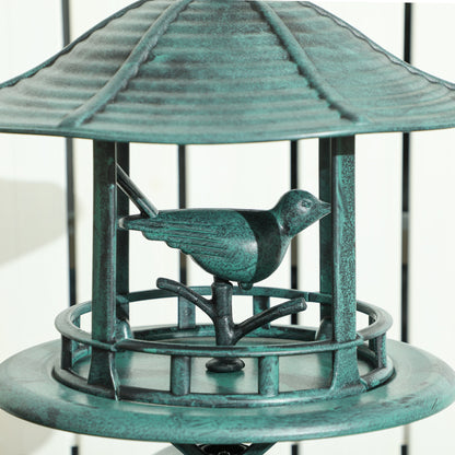 Antique green bird feeder with small roof and circular tray, bird perched