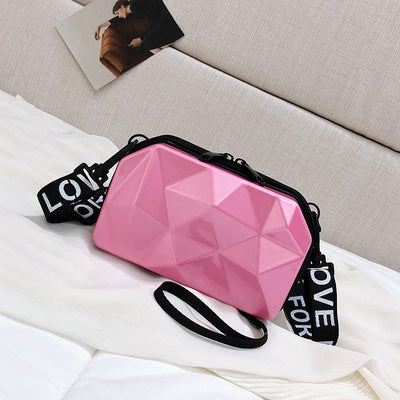 Pink geometric mini cosmetic bag with black zipper and wrist strap