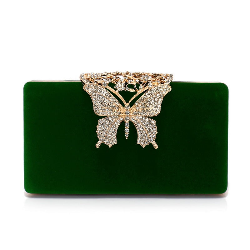 Dark green velvet evening clutch with rhinestone butterfly clasp