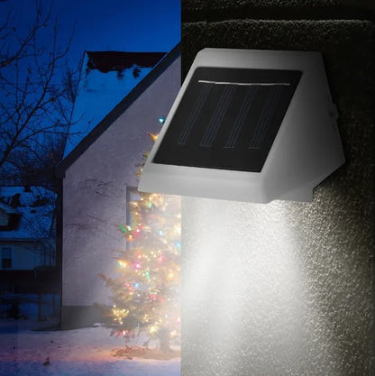 White solar stair light with solar panel and LED light panel in angled housing