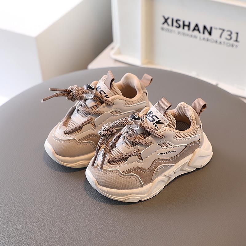 Kids mesh sneakers in tan with brown laces, sporty strap details, and thick sole