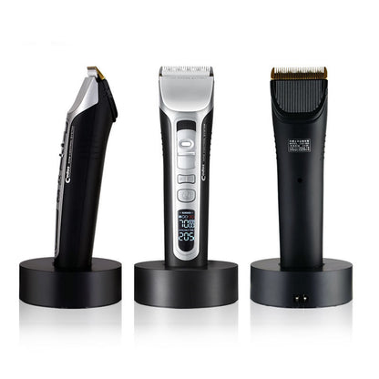 Three electric hair trimmers on black stands against a white background