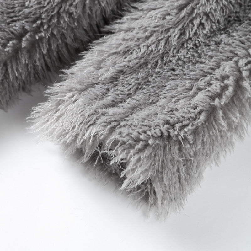 Women’s mid-length faux fur coat hem detail, gray shag texture and soft drape.