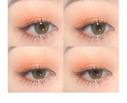 Close-up of eyes with makeup application on a white background