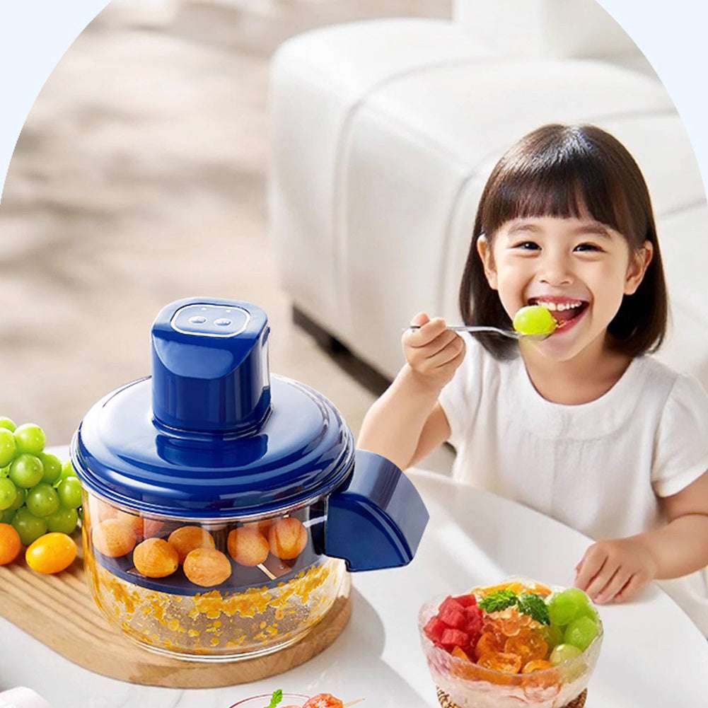 Child eating a colorful fruit salad with a blue juicer in the foreground.
